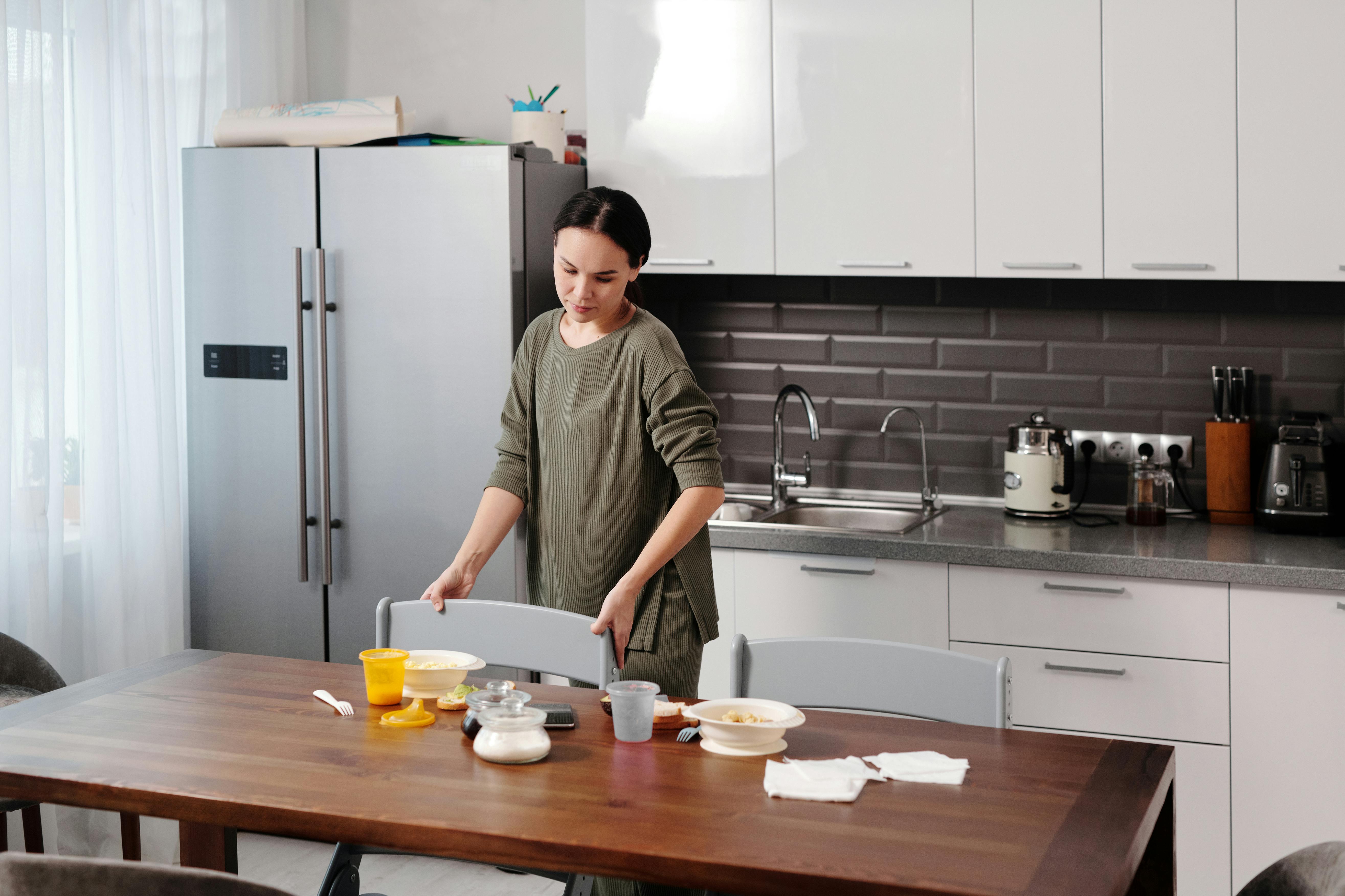 person%20tidying%20modern%20kitchen person%20tidying%20modern%20kitchen
